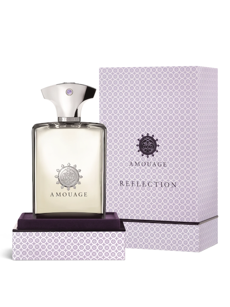 euaden Amouage Reflection Woman 100 ml EDP parfüm, şık cam şişesi ve desenli lila kutusu ile zarif bir sunumda.
