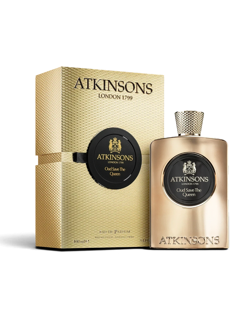 euaden Atkinsons Oud Save The Queen kadın parfümü, altın rengi şişesi ve lüks dokulu kutusuyla zarif bir sunumda.