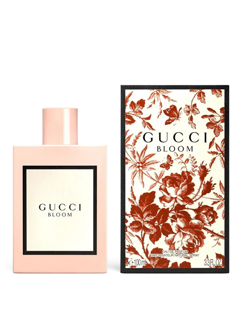 euaden Gucci Bloom 100 ml kadın parfümü, pudra pembesi şişesi ve çiçek desenli kutusuyla zarif bir sunum sergiliyor.